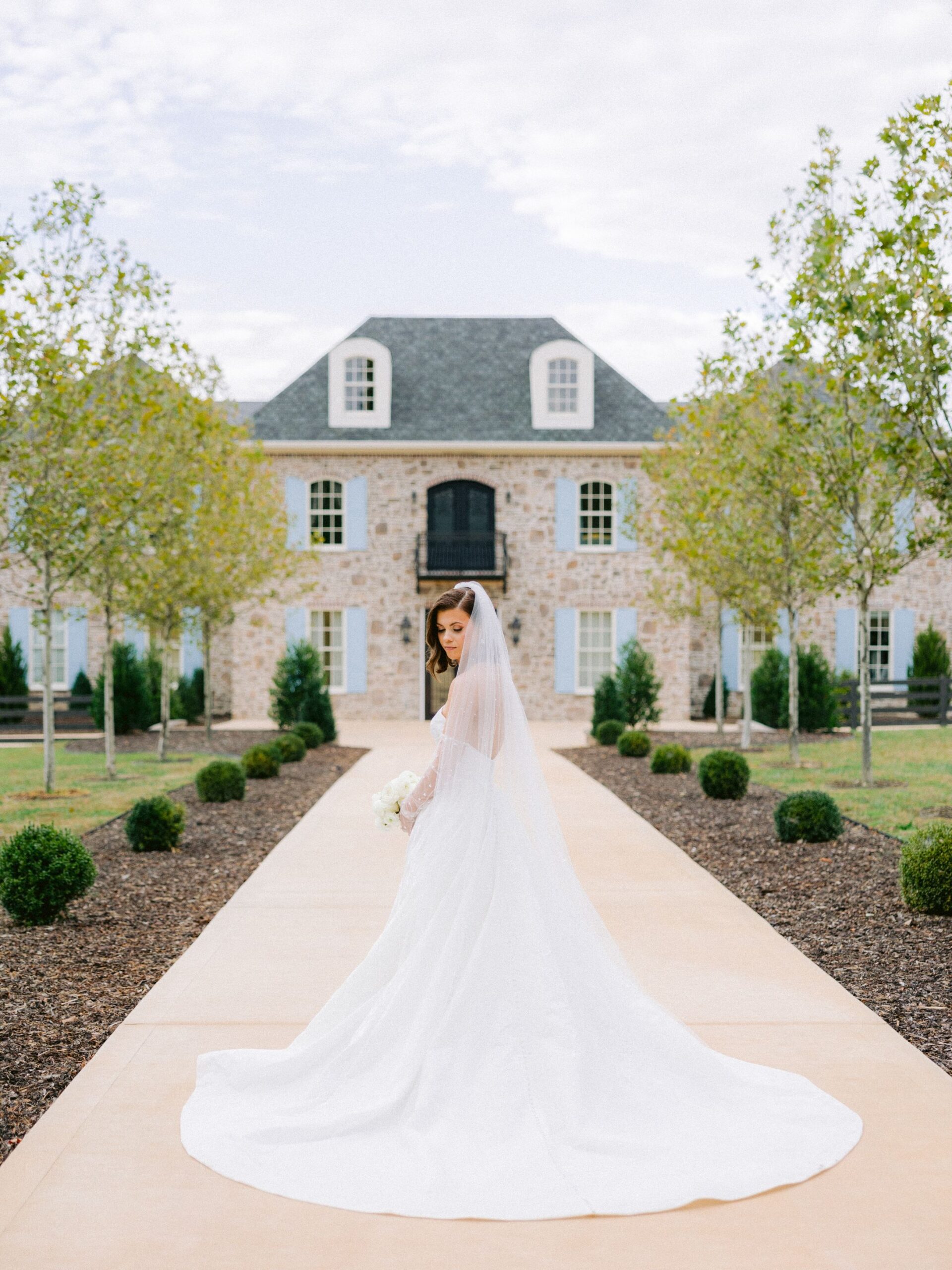 Bride in a full-length wedding gown for fall wedding fashion inspiration